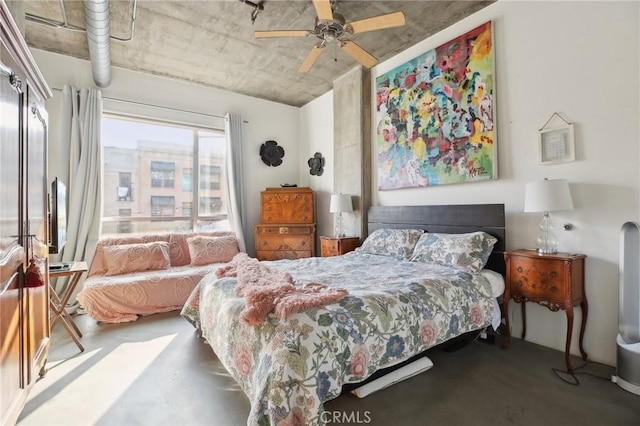 bedroom featuring ceiling fan and concrete floors