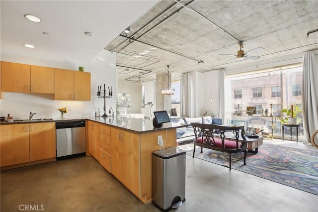 kitchen with dark stone counters, hanging light fixtures, kitchen peninsula, ceiling fan, and stainless steel dishwasher