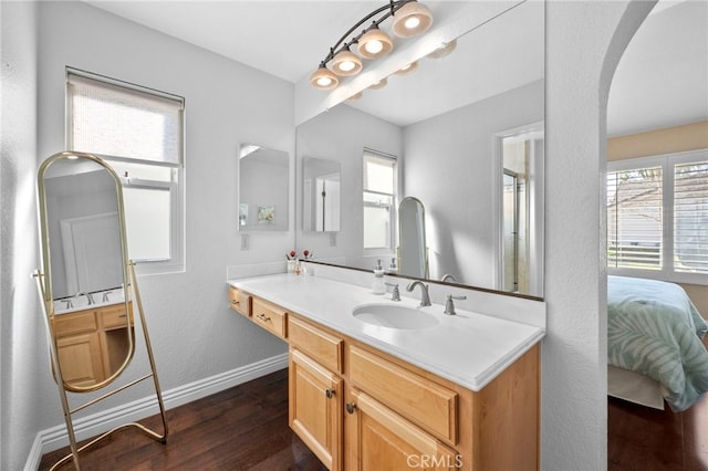 bathroom featuring hardwood / wood-style flooring and vanity