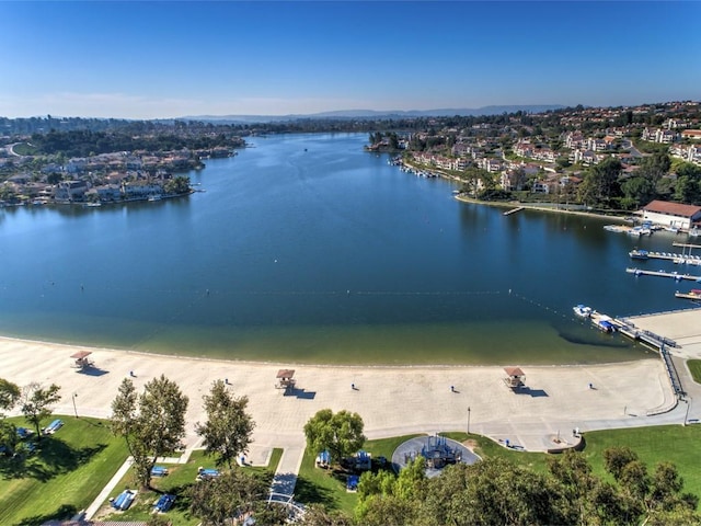 bird's eye view featuring a water view and a view of the beach