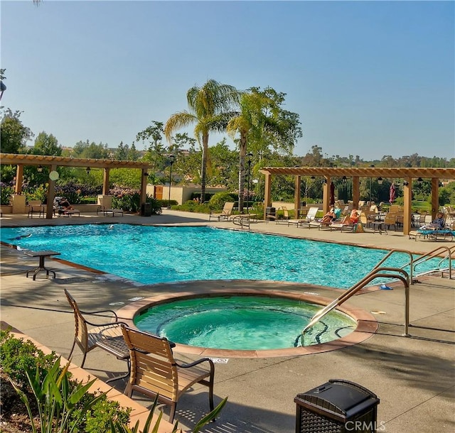 view of pool featuring a pergola, a patio, and a hot tub