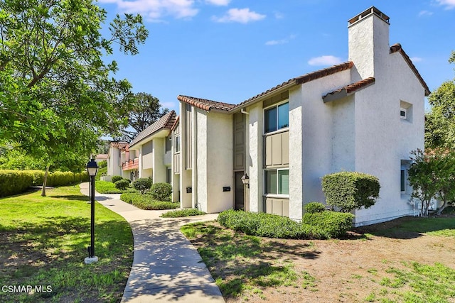 view of home's exterior featuring a lawn