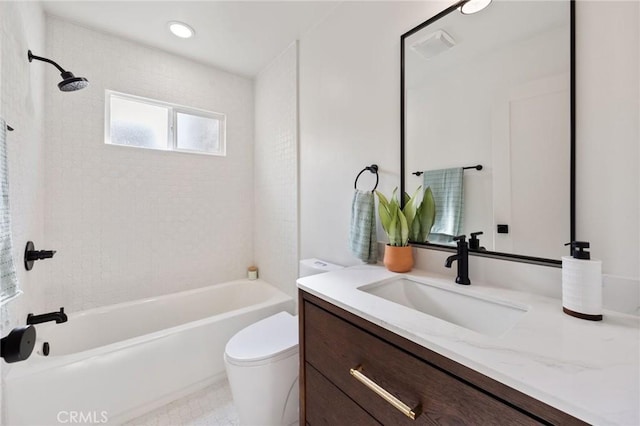 full bathroom with vanity, toilet, and tiled shower / bath