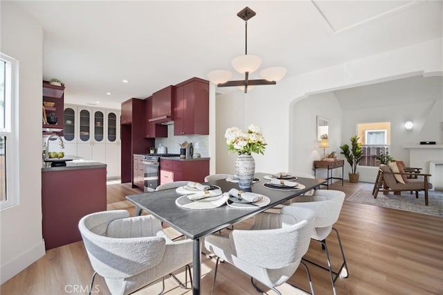 dining space featuring sink and hardwood / wood-style floors