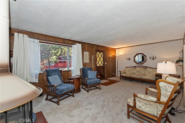 living area with light colored carpet and crown molding