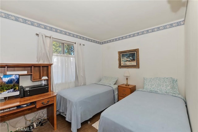 bedroom featuring dark wood-type flooring