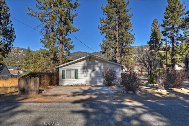 view of home's exterior with a mountain view