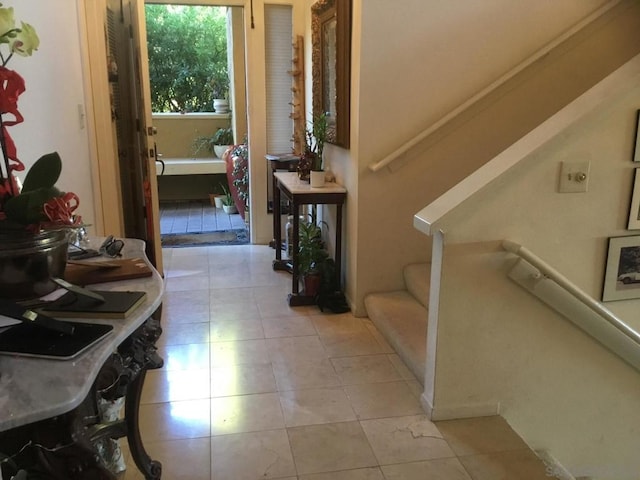 hallway with light tile patterned floors