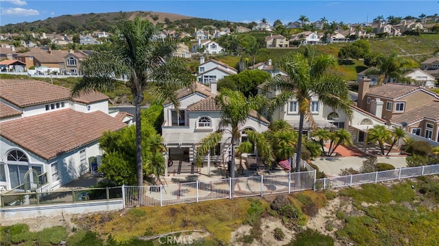 birds eye view of property featuring a mountain view