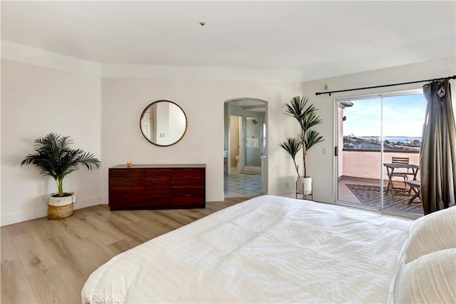 bedroom featuring access to exterior and wood-type flooring