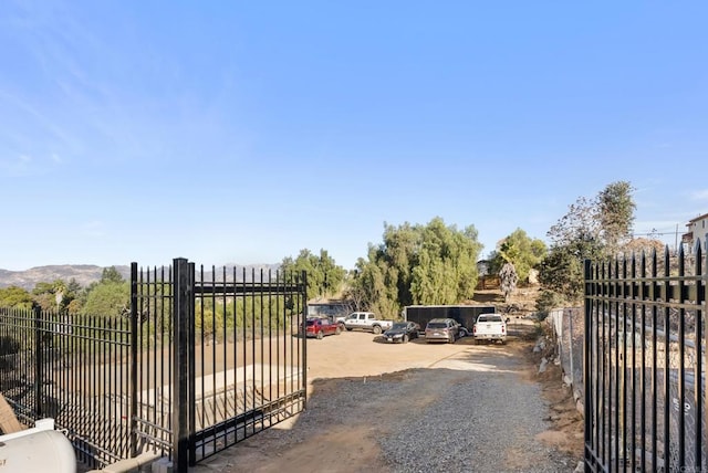 view of gate featuring a mountain view