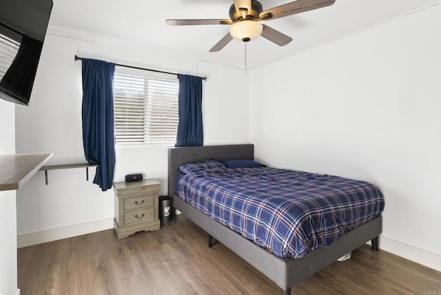 bedroom featuring ceiling fan and hardwood / wood-style floors