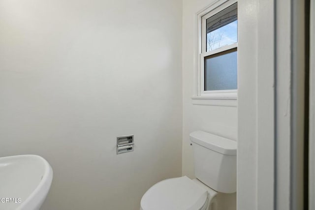 bathroom featuring toilet and sink