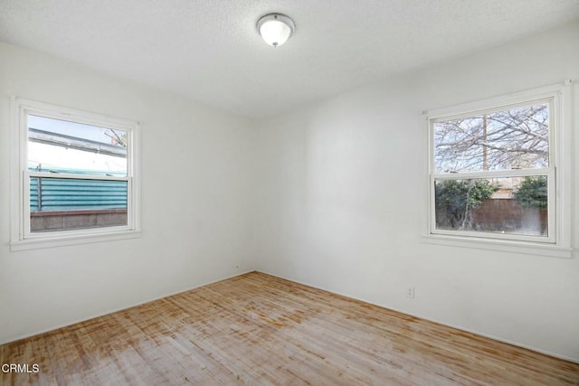 spare room featuring a healthy amount of sunlight