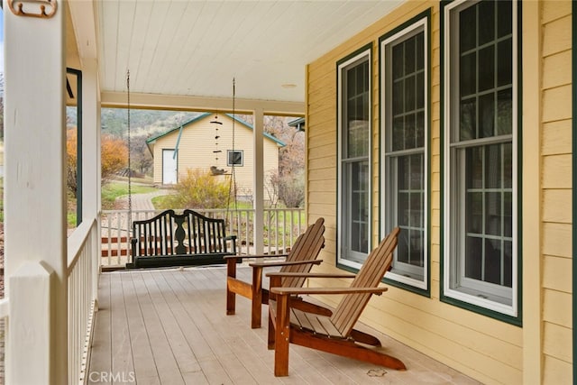 sunroom featuring wood ceiling