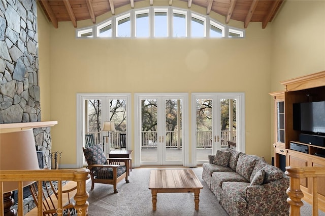 living room with wooden ceiling, french doors, and high vaulted ceiling