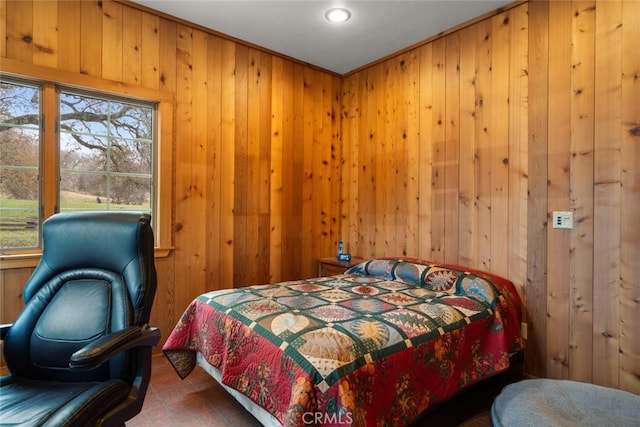 bedroom with wood walls