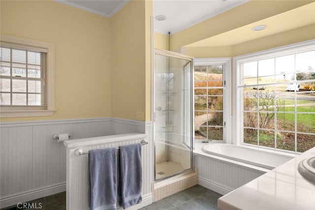 bathroom with a wealth of natural light, tile patterned floors, crown molding, and shower with separate bathtub