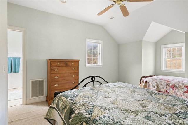 bedroom with light carpet, ceiling fan, and vaulted ceiling