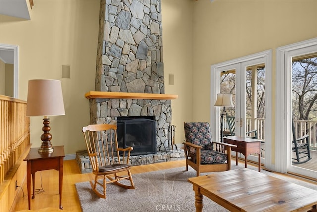 sitting room featuring a fireplace and wood-type flooring