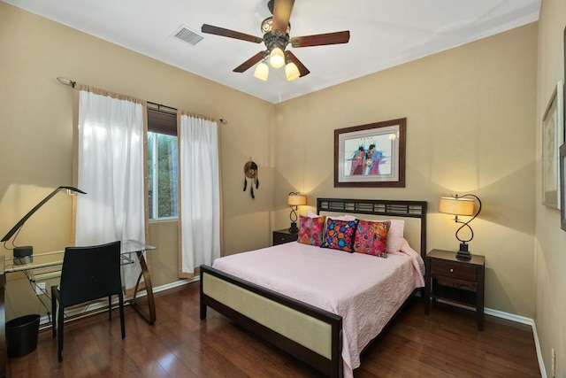 bedroom featuring ceiling fan and dark hardwood / wood-style floors