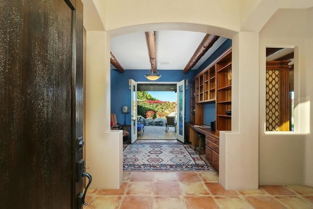 entryway with beam ceiling