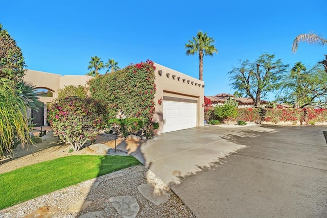 southwest-style home featuring a garage