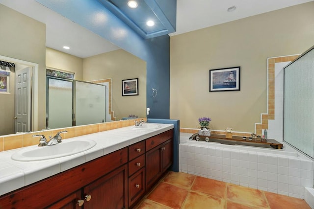 bathroom with vanity, tile patterned floors, and shower with separate bathtub