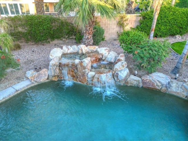 view of pool featuring pool water feature