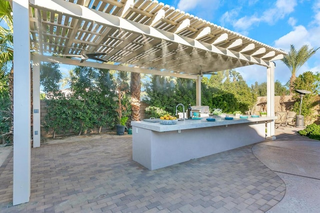 view of patio featuring a pergola, an outdoor bar, and ceiling fan