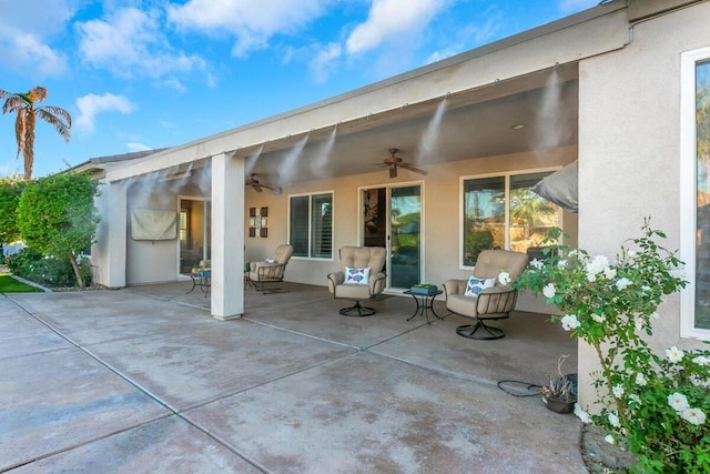 view of patio / terrace featuring ceiling fan