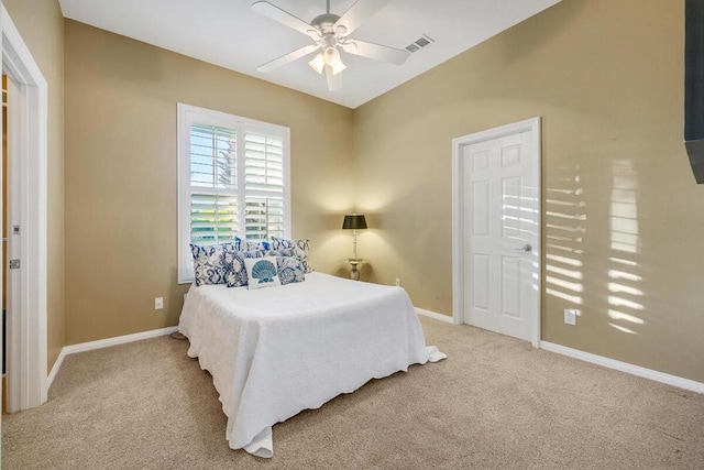 bedroom with ceiling fan and light colored carpet