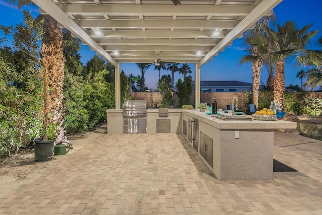 view of patio featuring grilling area and exterior kitchen