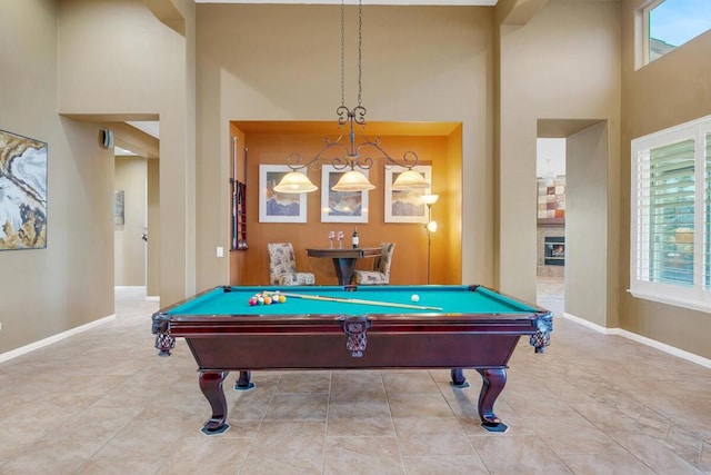 game room featuring a high ceiling and billiards