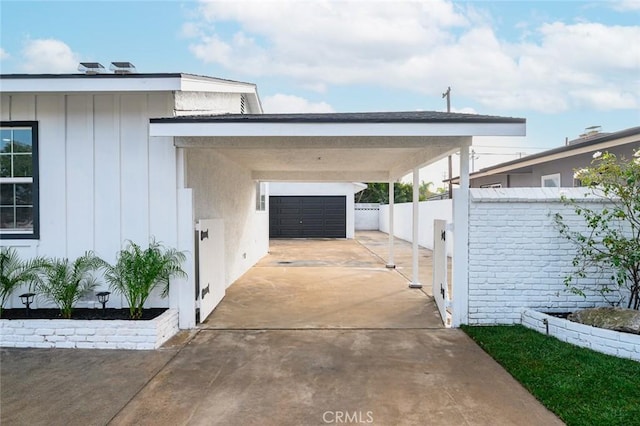 view of car parking with a garage and a carport