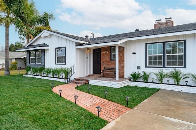 ranch-style house with a front lawn