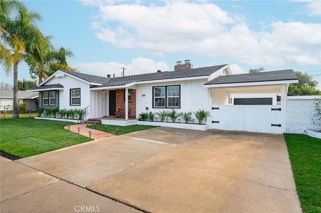 single story home featuring a garage and a front lawn