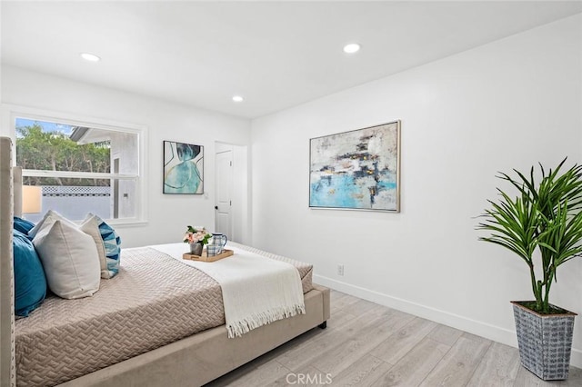 bedroom with light wood-type flooring