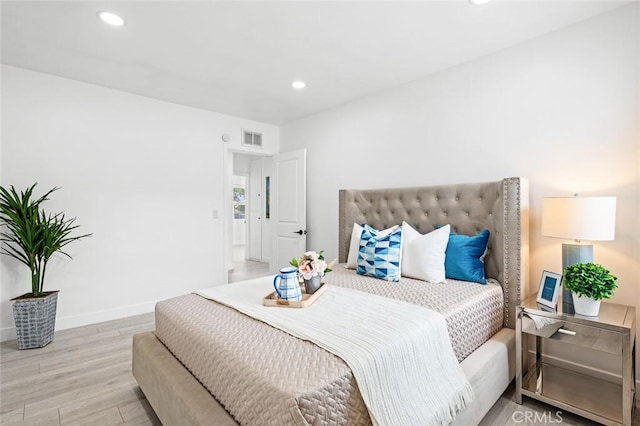 bedroom with light wood-type flooring