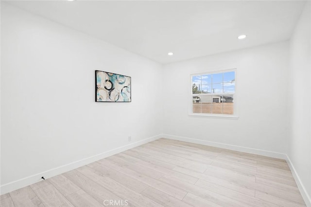 spare room featuring light wood-type flooring