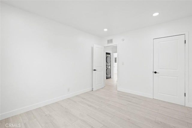 spare room featuring light hardwood / wood-style flooring