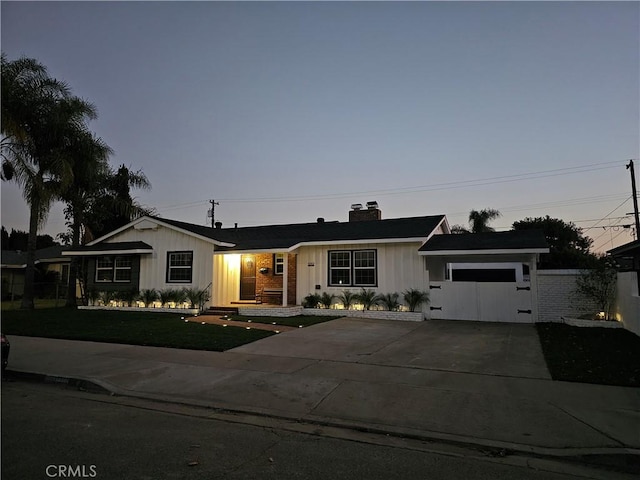 ranch-style house featuring a garage