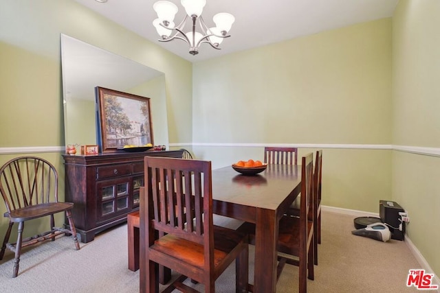 dining area with light carpet and an inviting chandelier