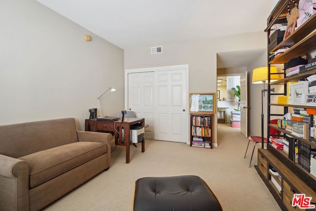 living room featuring light carpet