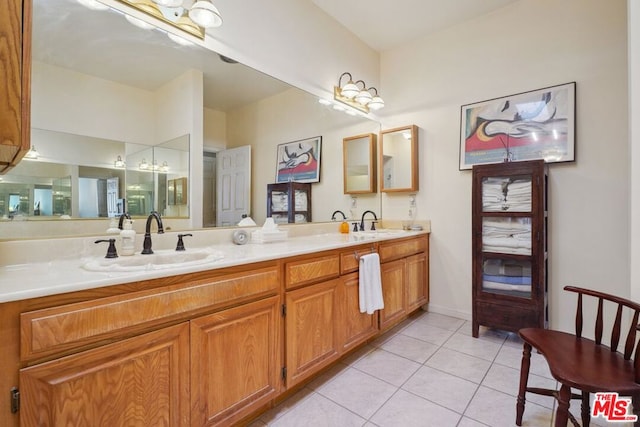 bathroom with vanity and tile patterned floors