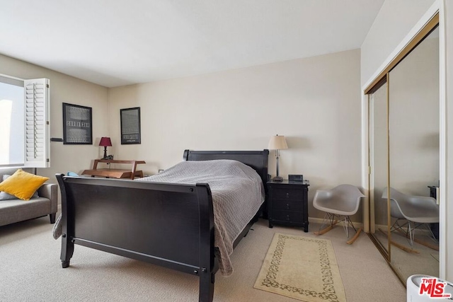 bedroom featuring carpet floors and a closet