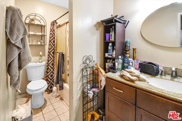 full bathroom with toilet, vanity, tile patterned floors, and shower / tub combo with curtain