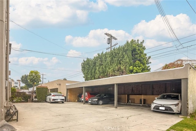 view of vehicle parking with a carport