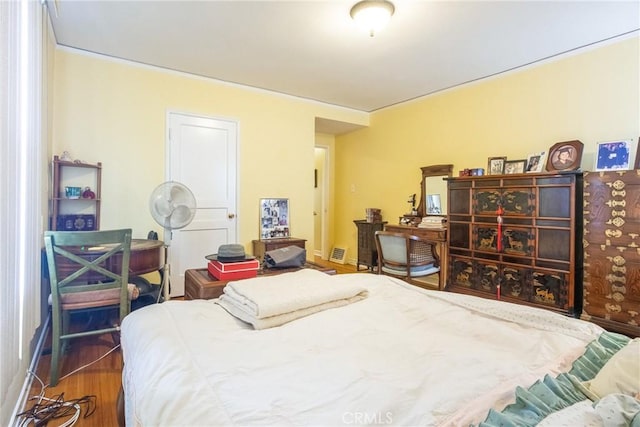 bedroom with wood-type flooring