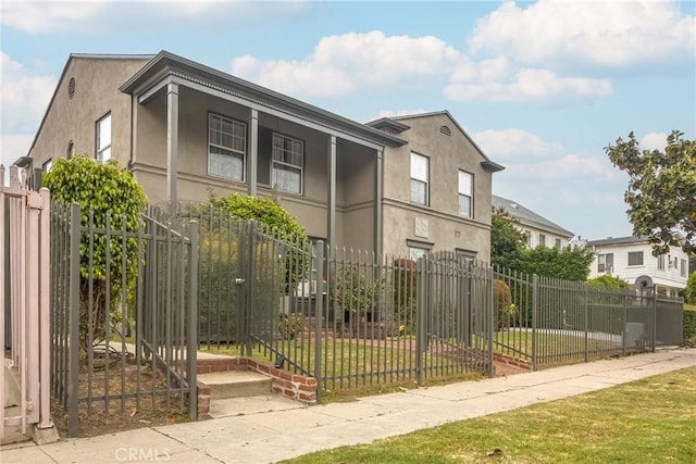 view of side of home with a yard